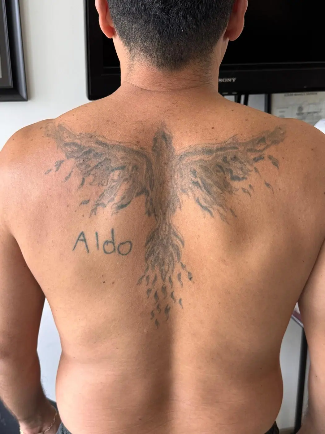 Before: faded phoenix on the back, blurry lines and no contrast