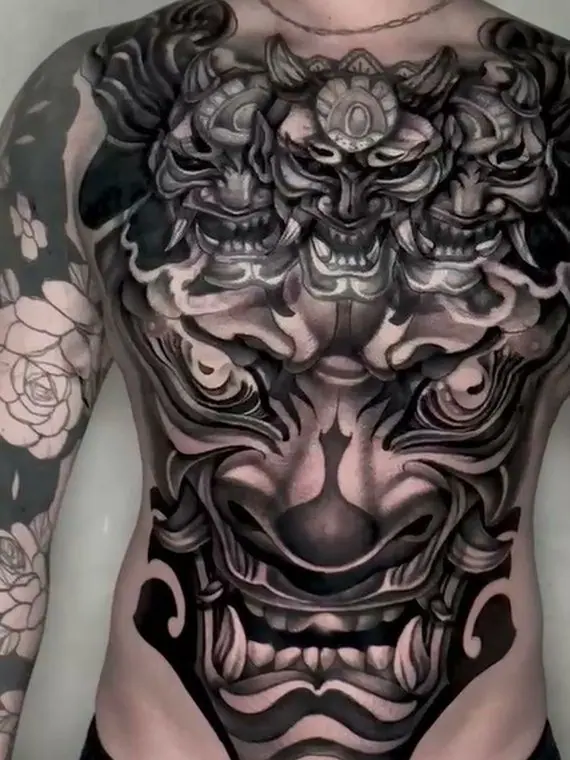 After: the full torso finished in black and grey, with the demons redone
